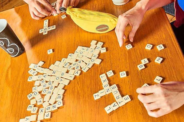 Bananagrams Classic Word Game – Fast-Paced Spelling & Anagram, Family & Travel Game , 144 Letter Tiles in Portable Banana Pouch, 1–8 Players, Educational Wordplay Fun for Ages 7+ - Image 2