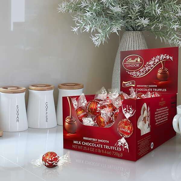 Lindt LINDOR Milk Chocolate Candy Truffles, Milk Chocolate with Smooth, Melting Truffle Center, 25.4 oz., 60 Count - Image 2