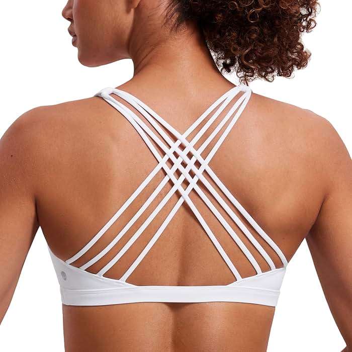 CRZ YOGA Naked Feeling Strappy Sports Bras for Women - Criss Cross Back Wireless Padded Cami Yoga Workout Top - Image 1