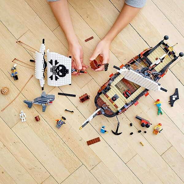 LEGO Creator 3 in 1 Pirate Ship Building Set, Kids can Rebuild The Pirate Ship into an Inn or Skull Island, Features 4 Minifigures and Shark Toy, Makes a Great Gift for Kids Ages 9+ Years Old, 31109 - Image 7