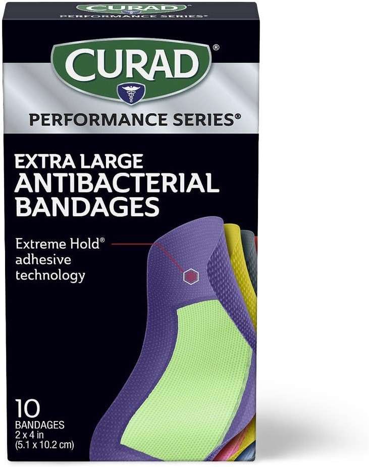 CURAD Performance Series IRONMAN Antibacterial Bandages, Extreme Hold Adhesive Technology, Extra Large Flexible Fabric Bandages for Cuts, Scrapes, & Burns, Assorted Colors, 2 x 4 inches, 10 Count - Image 1