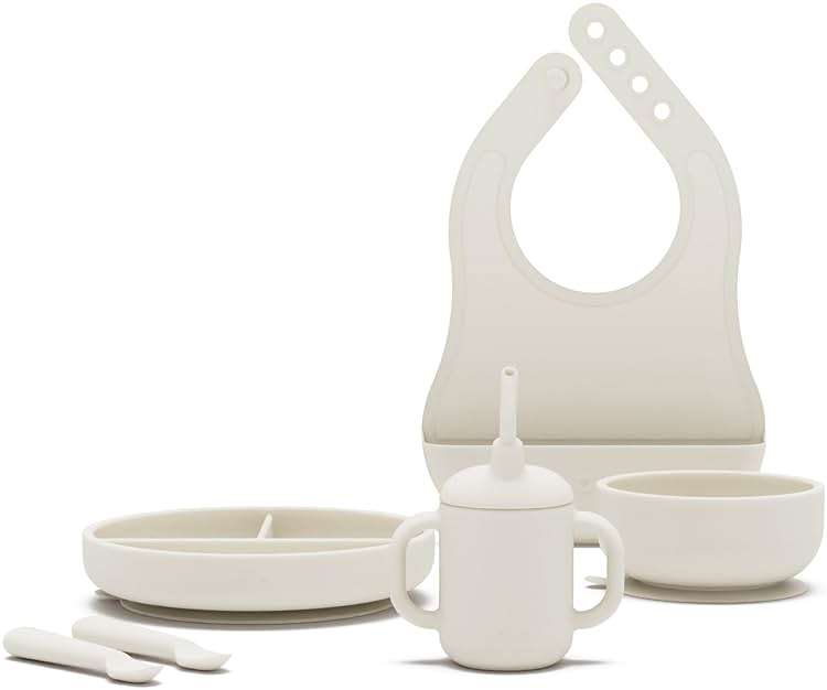 Lalo First Bites Silicone Baby Feeding Set - Baby Led Weaning Supplies - Non-Toxic Silicone - Includes 1 Bib, 2 Spoons, Training Cup, Suction Plate and Bowl - 6 Pieces - Oatmeal - Image 1
