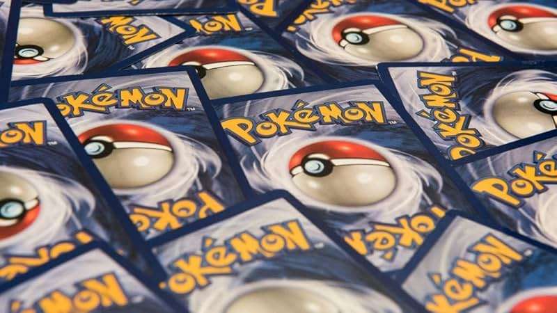 Pokemon TCG: 150 Assorted Pokemon Card Lot with Foils - Free Bonus Collector's Tin Included! - Image 1