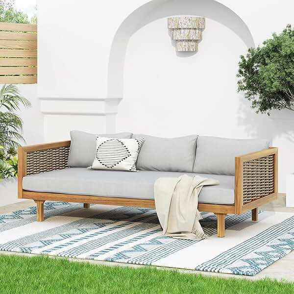 Christopher Knight Home Outdoor 3 Seater Acacia Wood Daybed with Fabric Water Resistant and Removable Cushions, Patio Garden Sofa with Wicker Armrest and Slat Paneling Back, Teak and Light Grey - Image 1