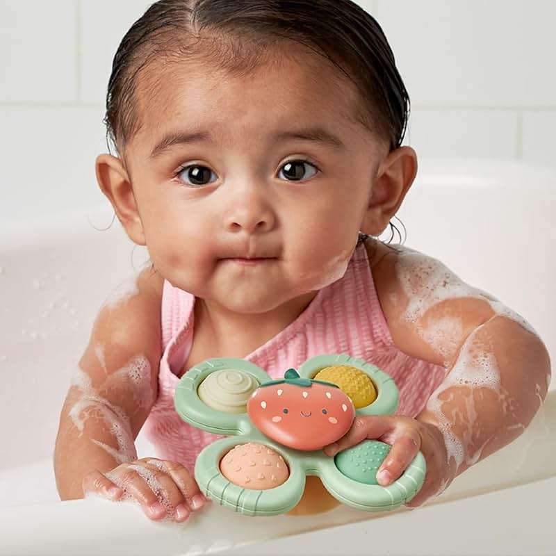 Itzy Ritzy Pop & Whirl – Fidget Spinner Travel & Bath Toy for Babies & Toddlers – Fidget w/Textured Silicone Popper to Develop Fine Motor Skills –Sticks to Highchairs, Tables, Tubs, More (Strawberry) - Image 9