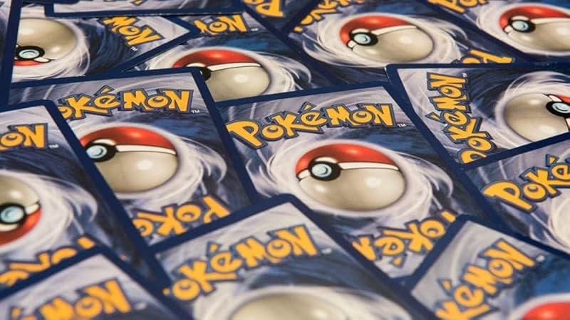 Pokemon TCG: 150 Assorted Pokemon Card Lot with Foils - Free Bonus Collector's Tin Included! - Product Image